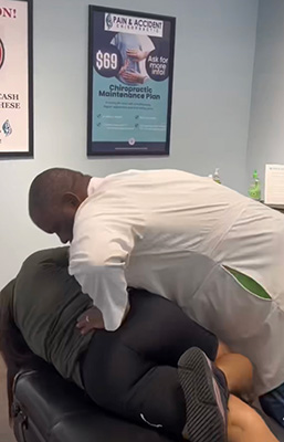 Chiropractor Winder GA Torey Evans Adjusting Patients Back